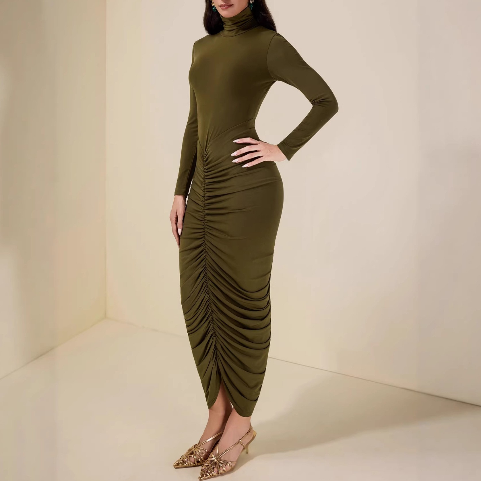 High-neck long-sleeved green pleated midriff-baring women's dress with a fitted waist and full skirt